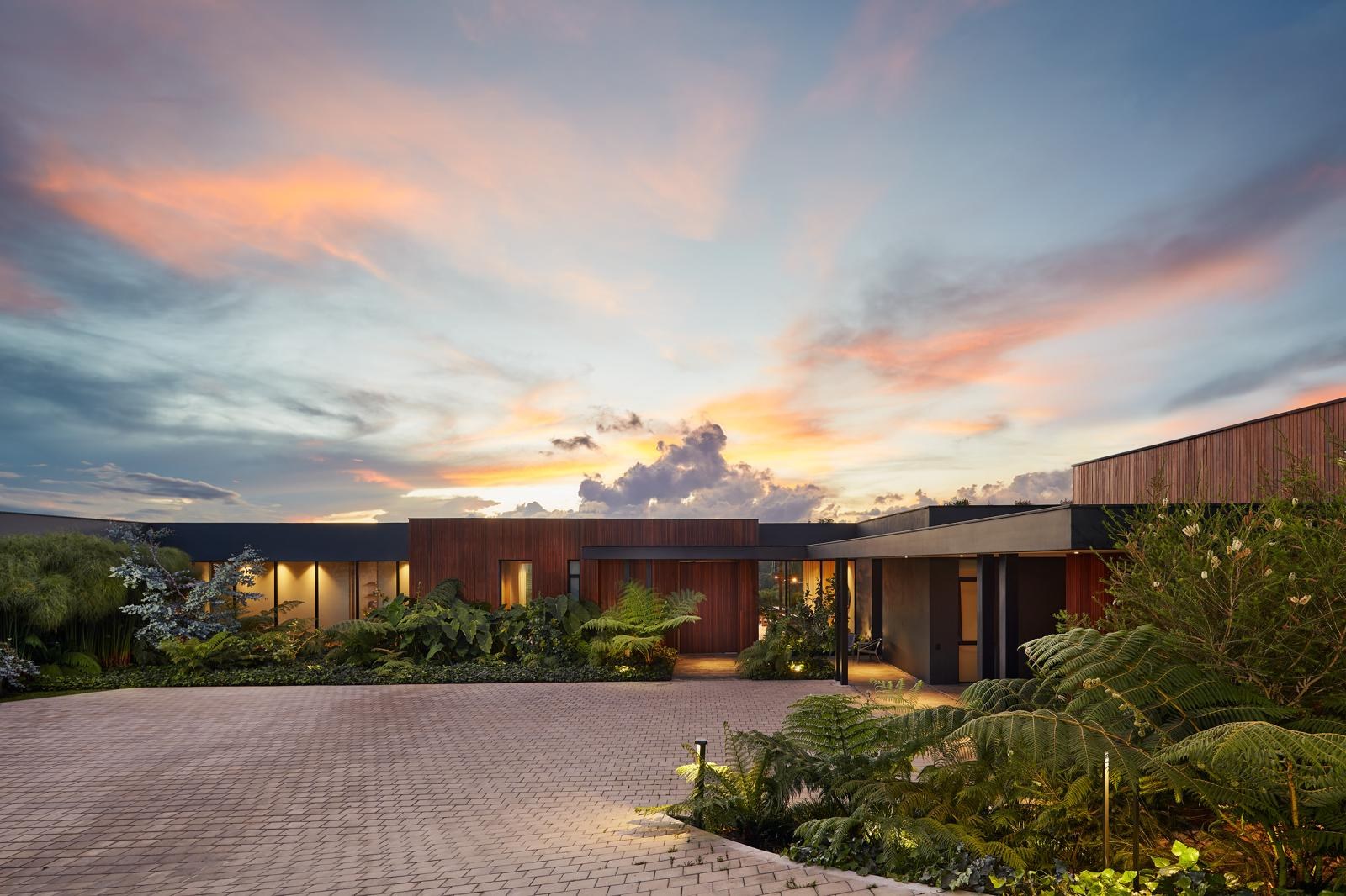 118 — completed residence at dusk, photographed on site