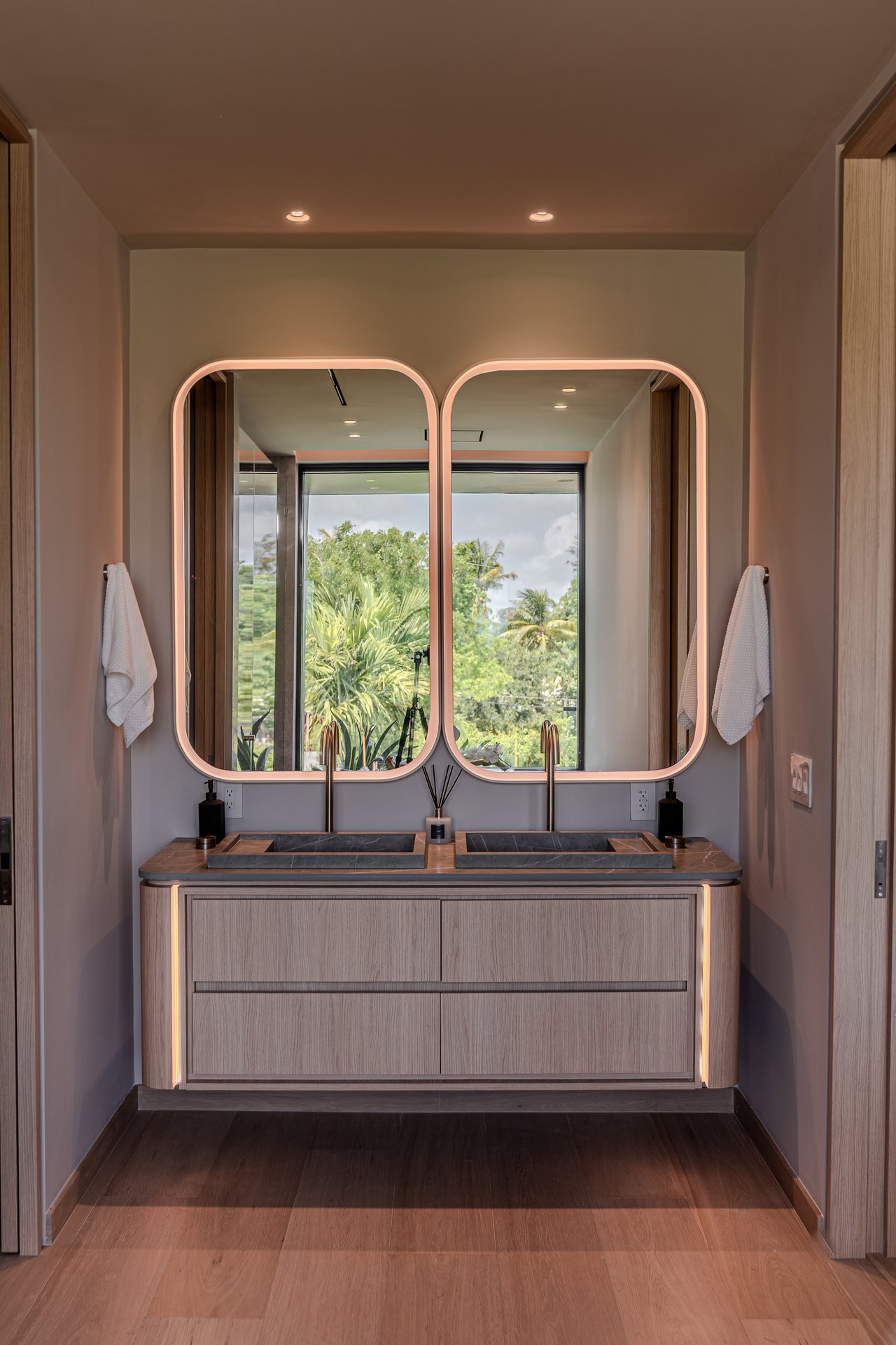 Dragon Millwork — installed double vanity with lit mirrors, Jefferson House