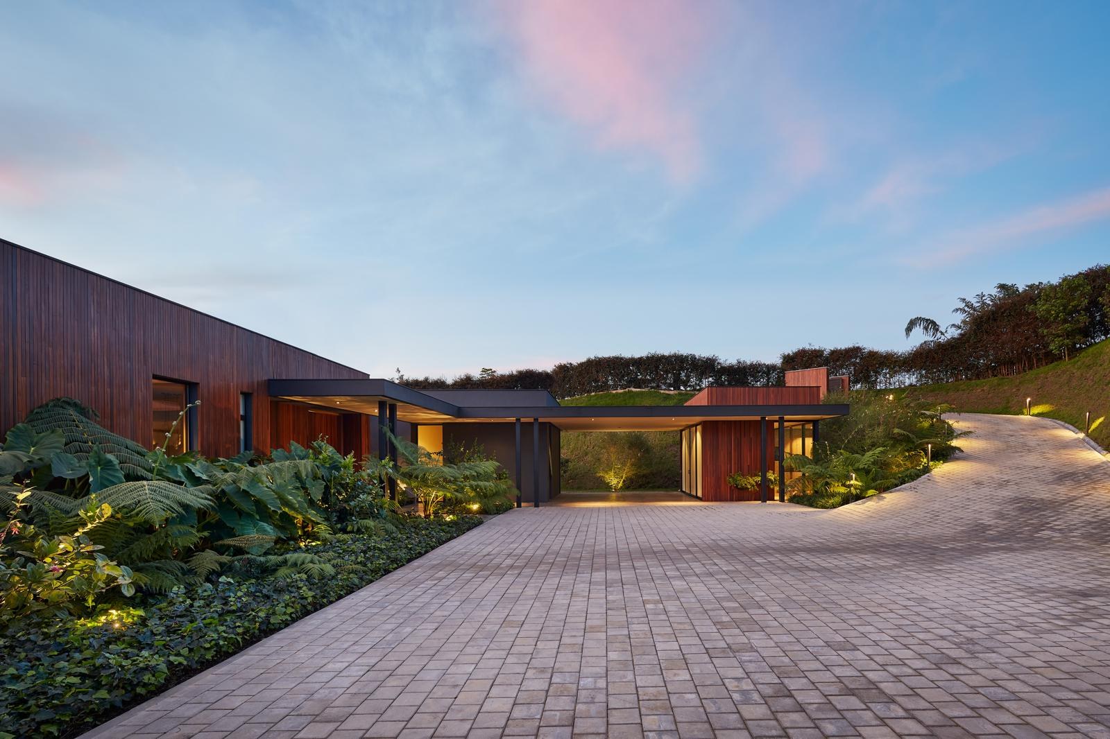 118 — arrival drive and carport at dusk