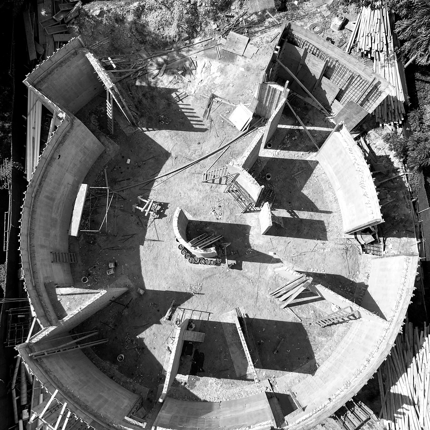 211 — circular concrete plan seen from above, June 2026