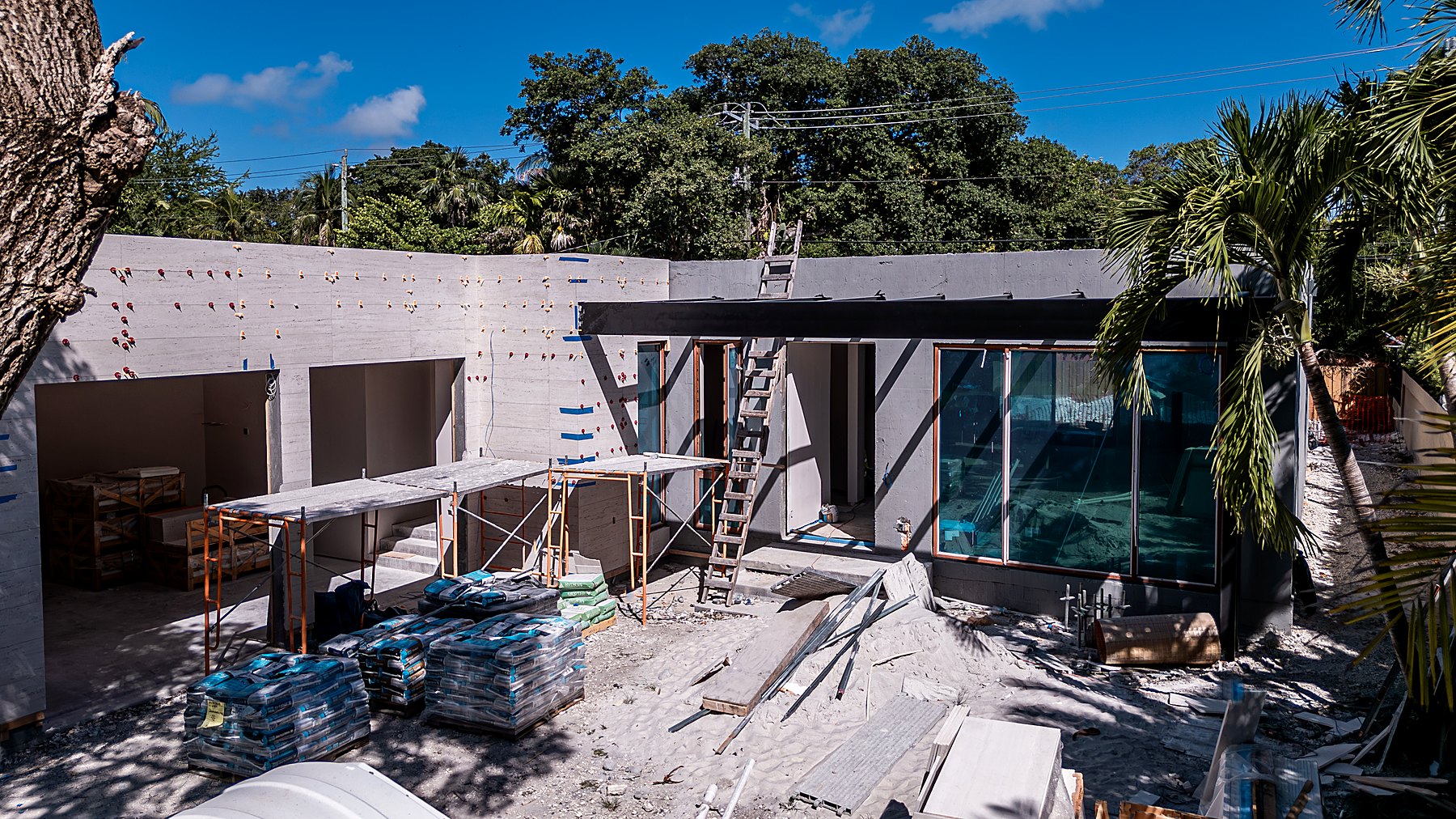 285 — pool terrace and glazing under construction, June 2026