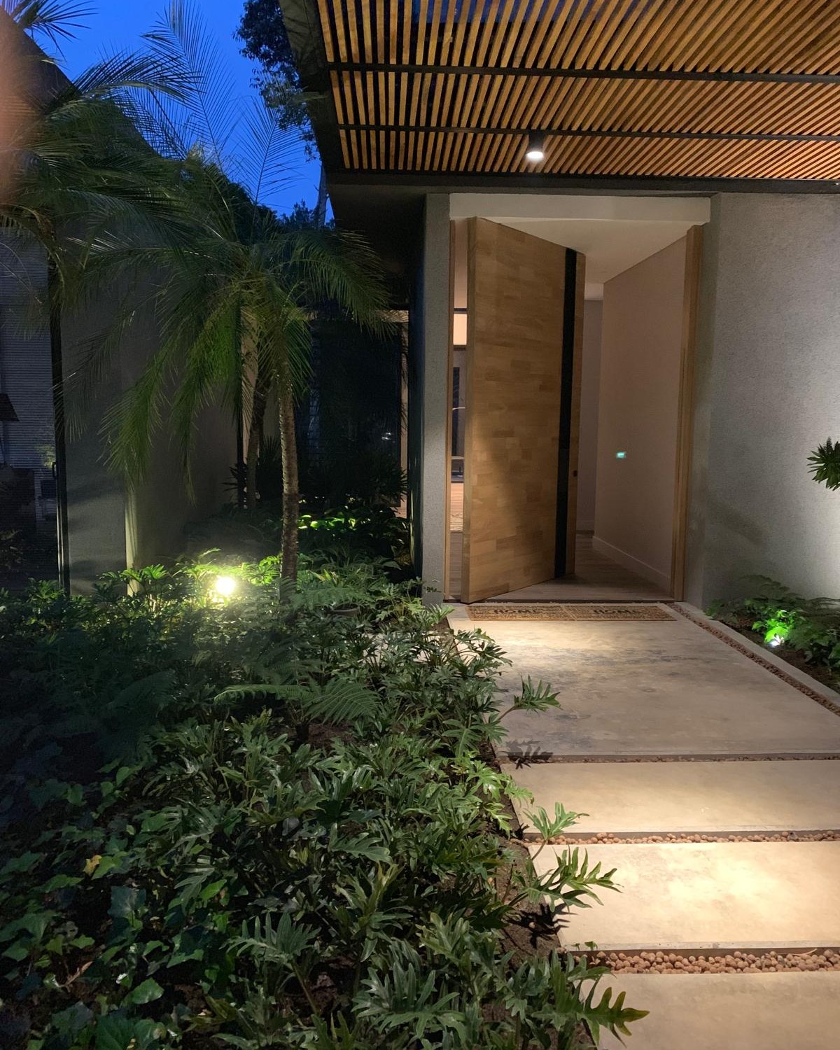 JL — completed residence, entry garden at dusk